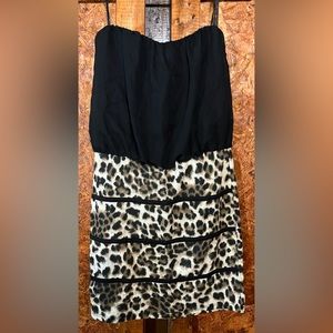 Short women’s medium dress with a black and cheetah pattern